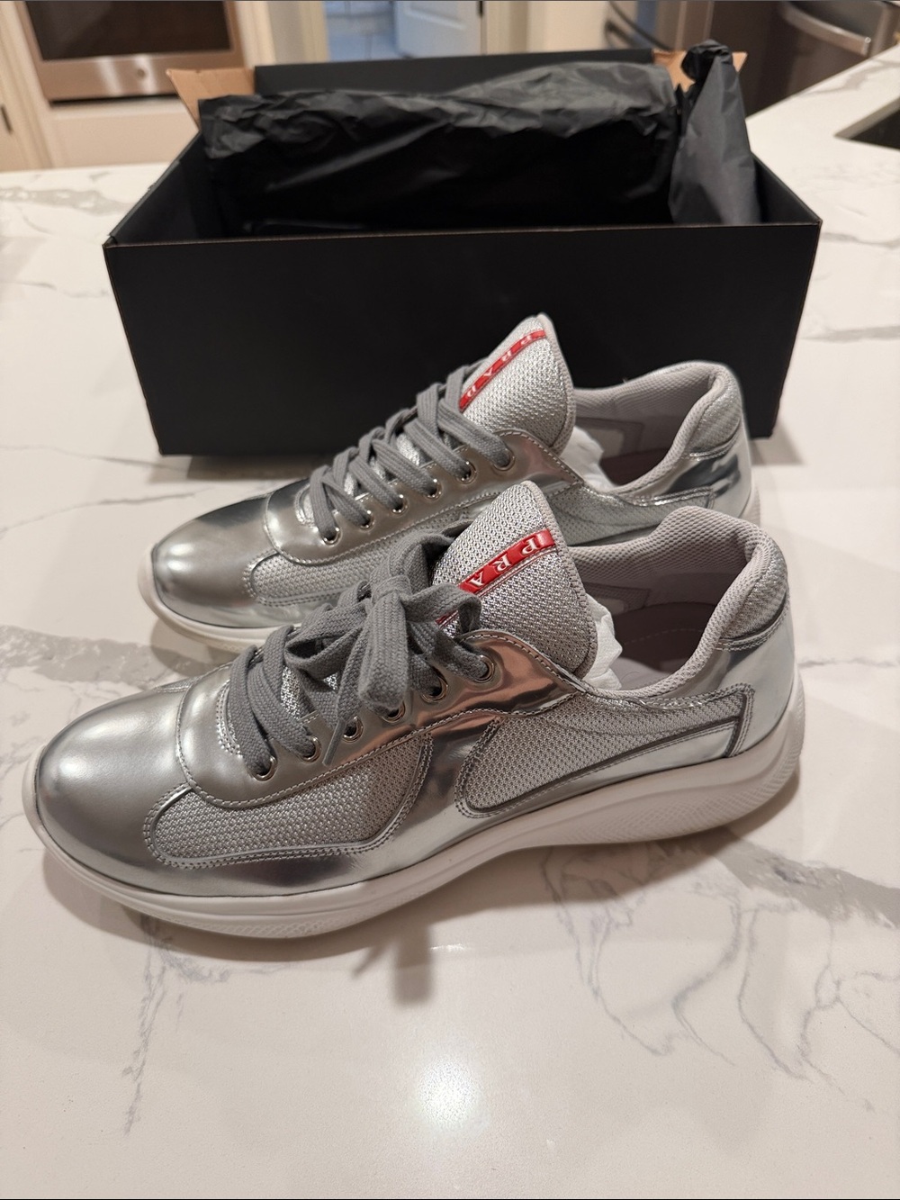 Prada Silver Metallic Mesh Lace-Up Sneakers with Red Logo Tab